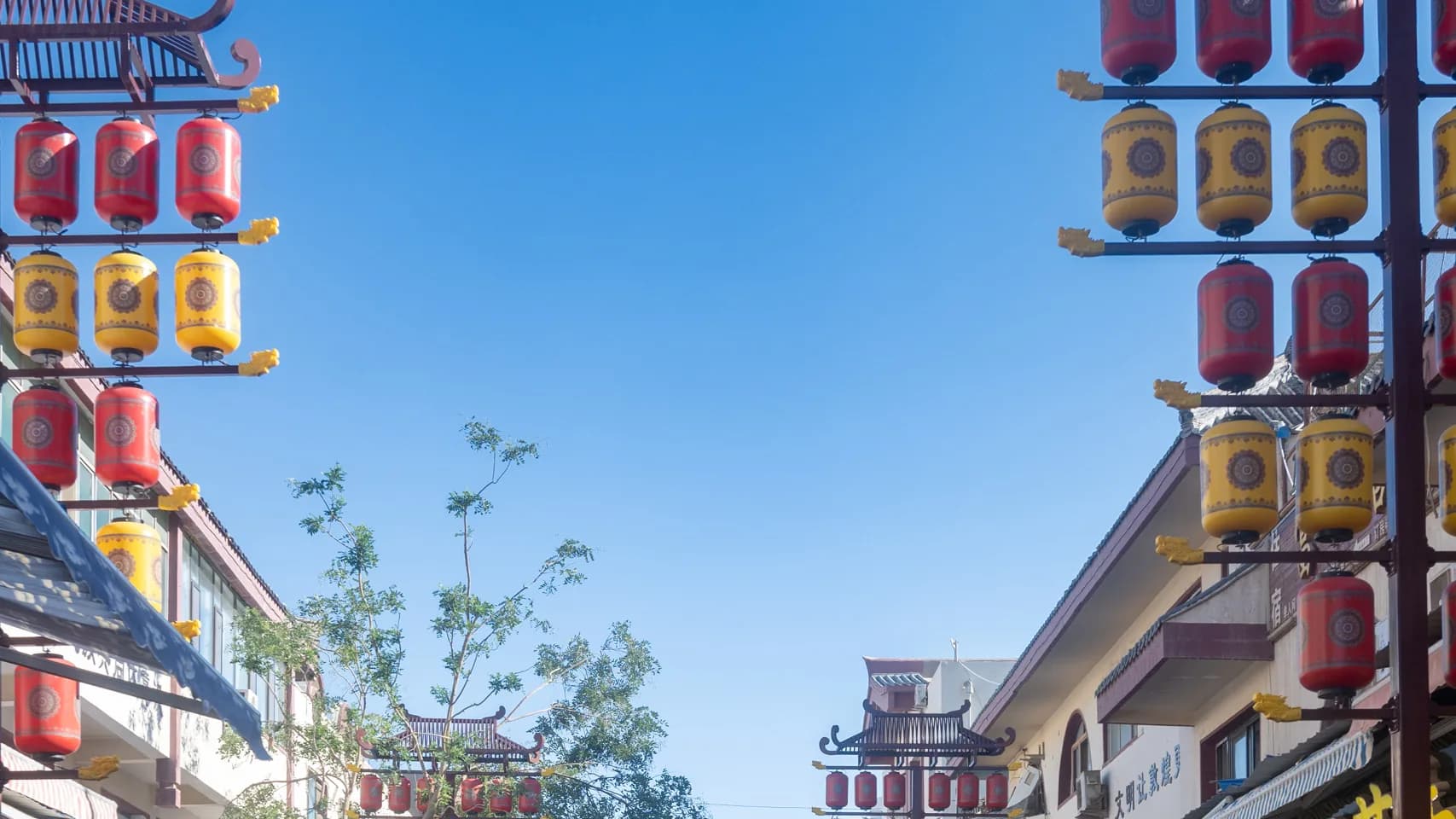 Cropped daytime view of lanterns and storefronts at Dunhuang Night Market