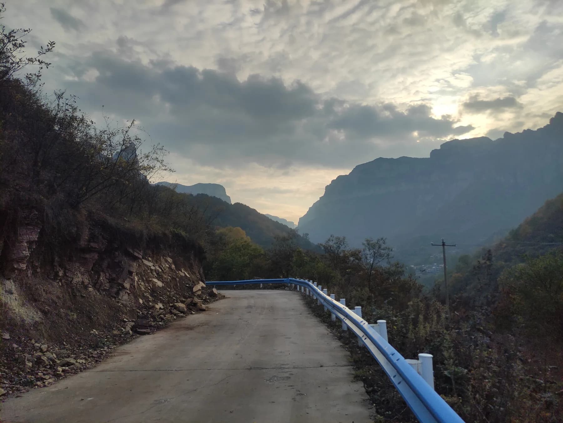 Narrow mountain road in Shibanyan township with Taihang cliffs beyond