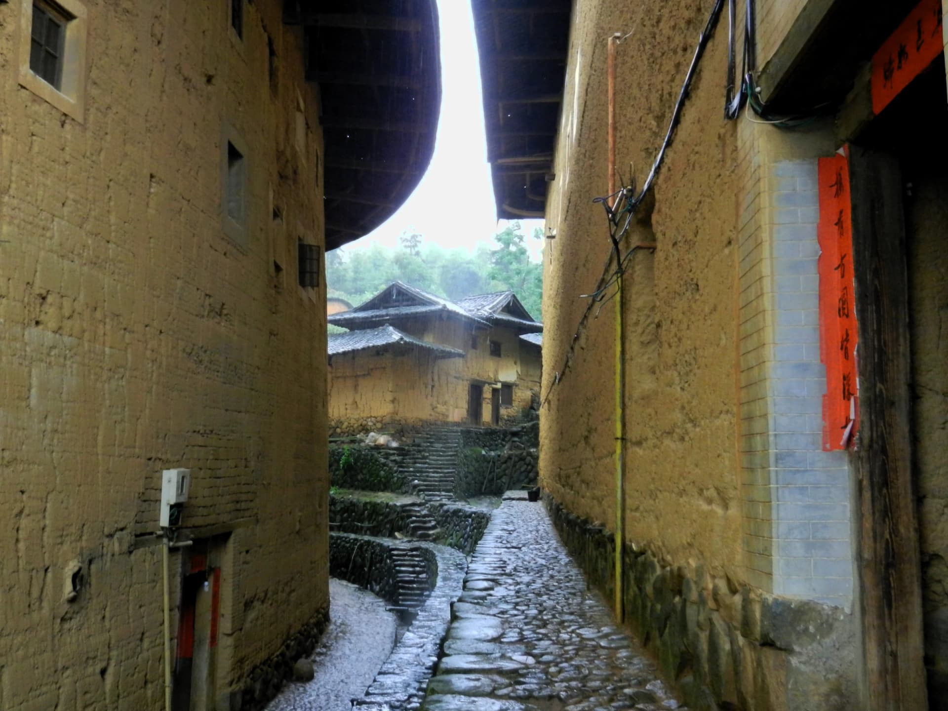 Earth wall and village lane in Gaobei Tulou Cluster