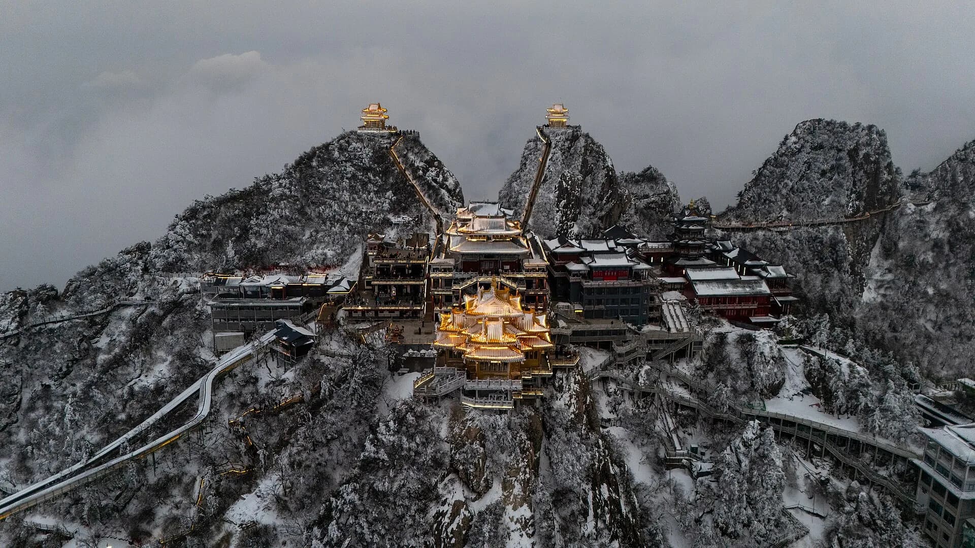 Licensed winter aerial view of Laojun Mountain's steep summit complex