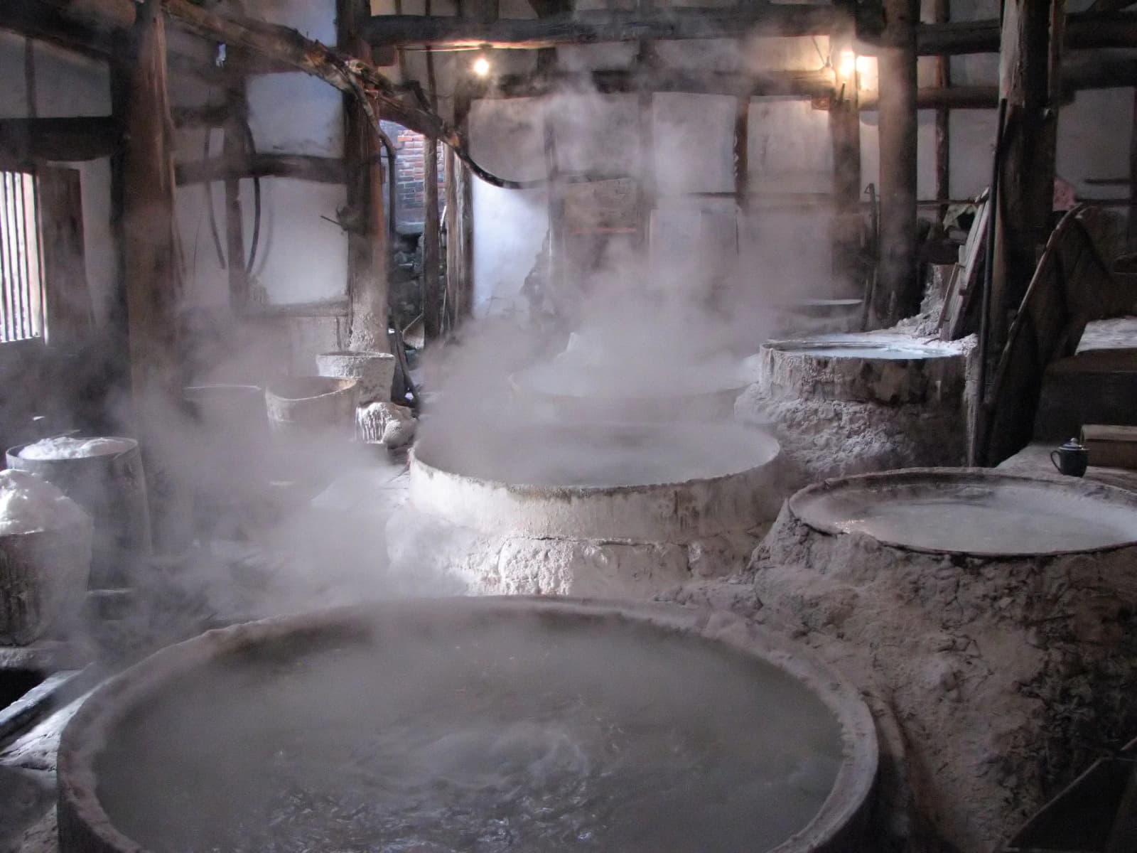 Salt-boiling pans and equipment inside a historic well-salt production setting