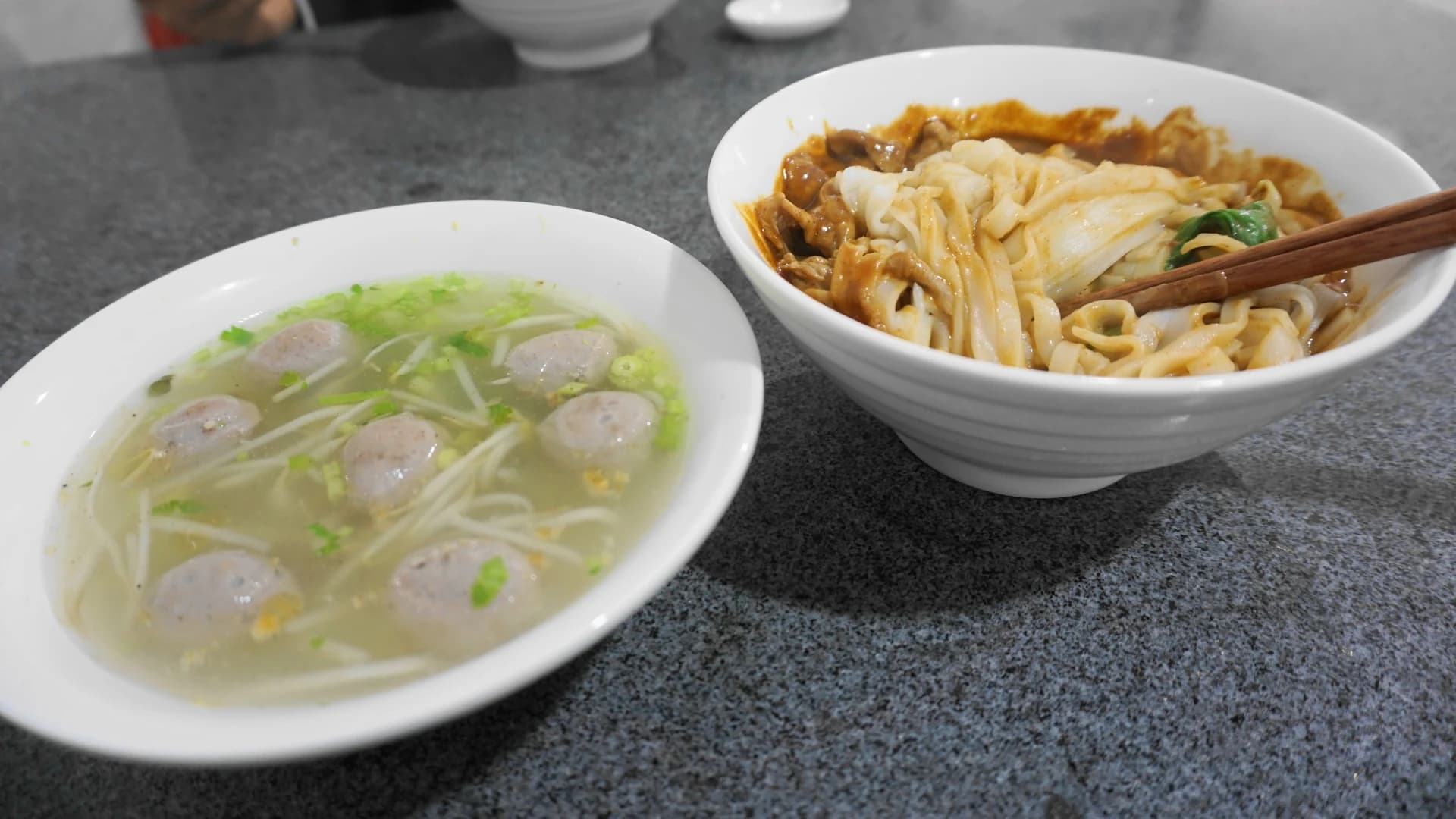 Chaozhou beef-ball soup beside a bowl of shacha noodles