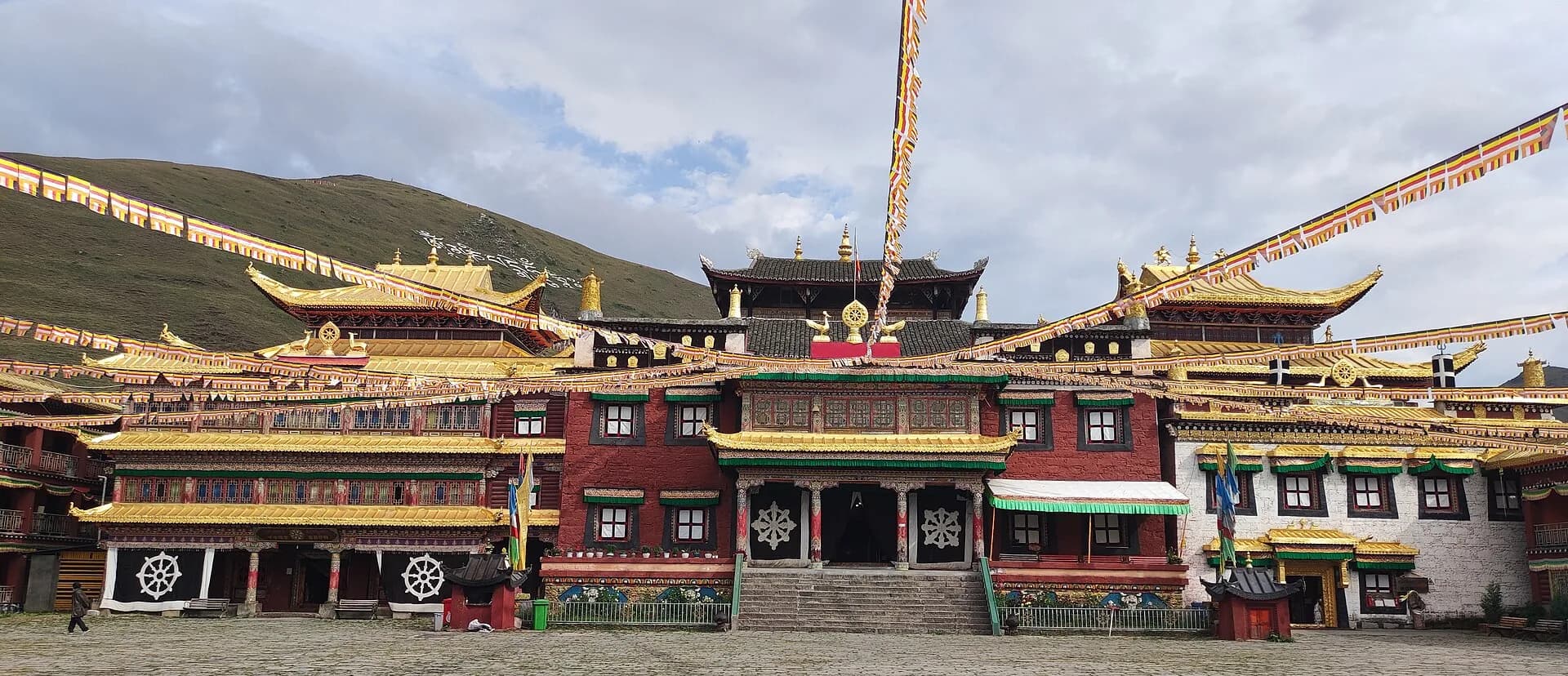 Tagong Monastery standing against the broad highland landscape