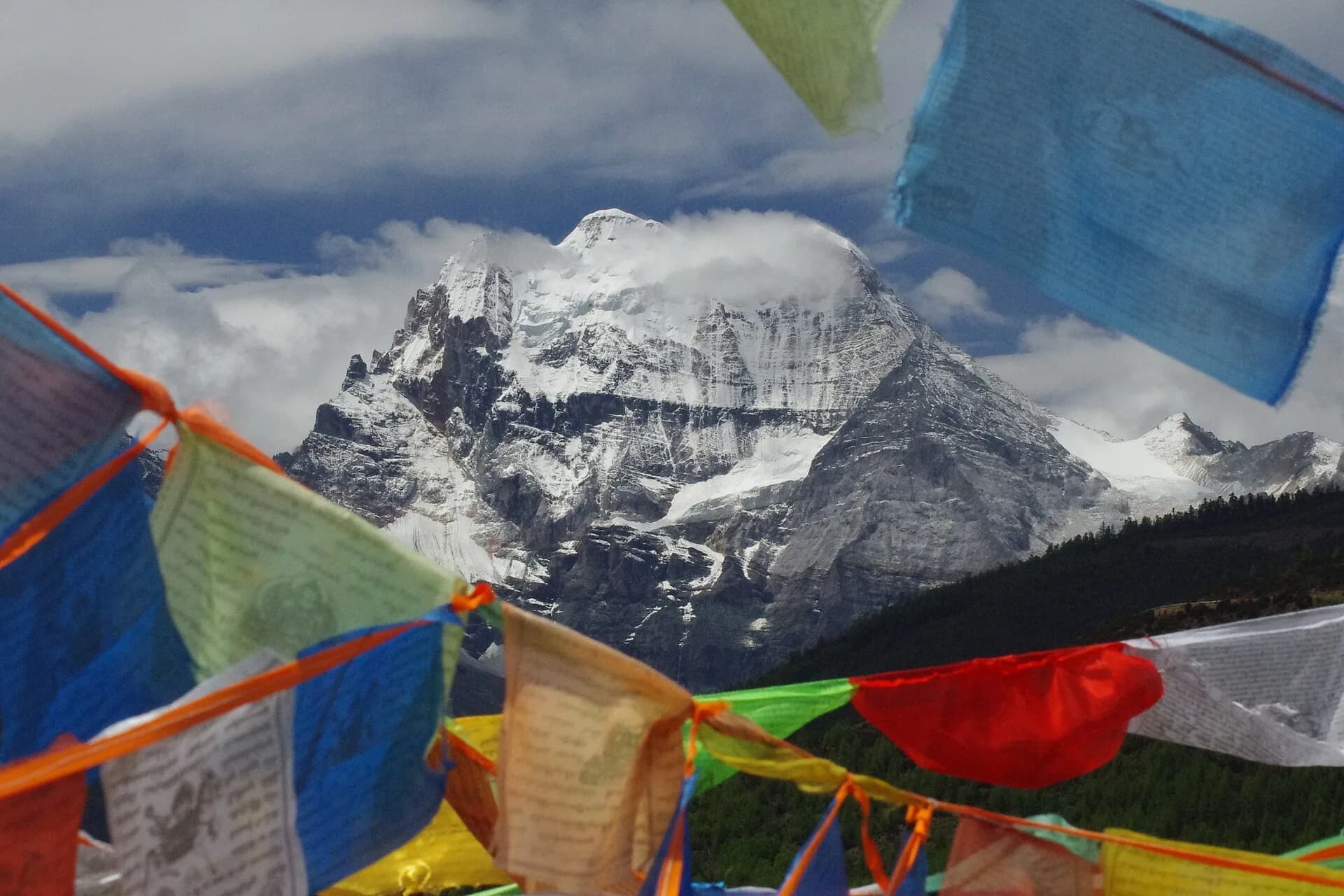 Mount Xiannairi above the high valley landscape of Daocheng Yading
