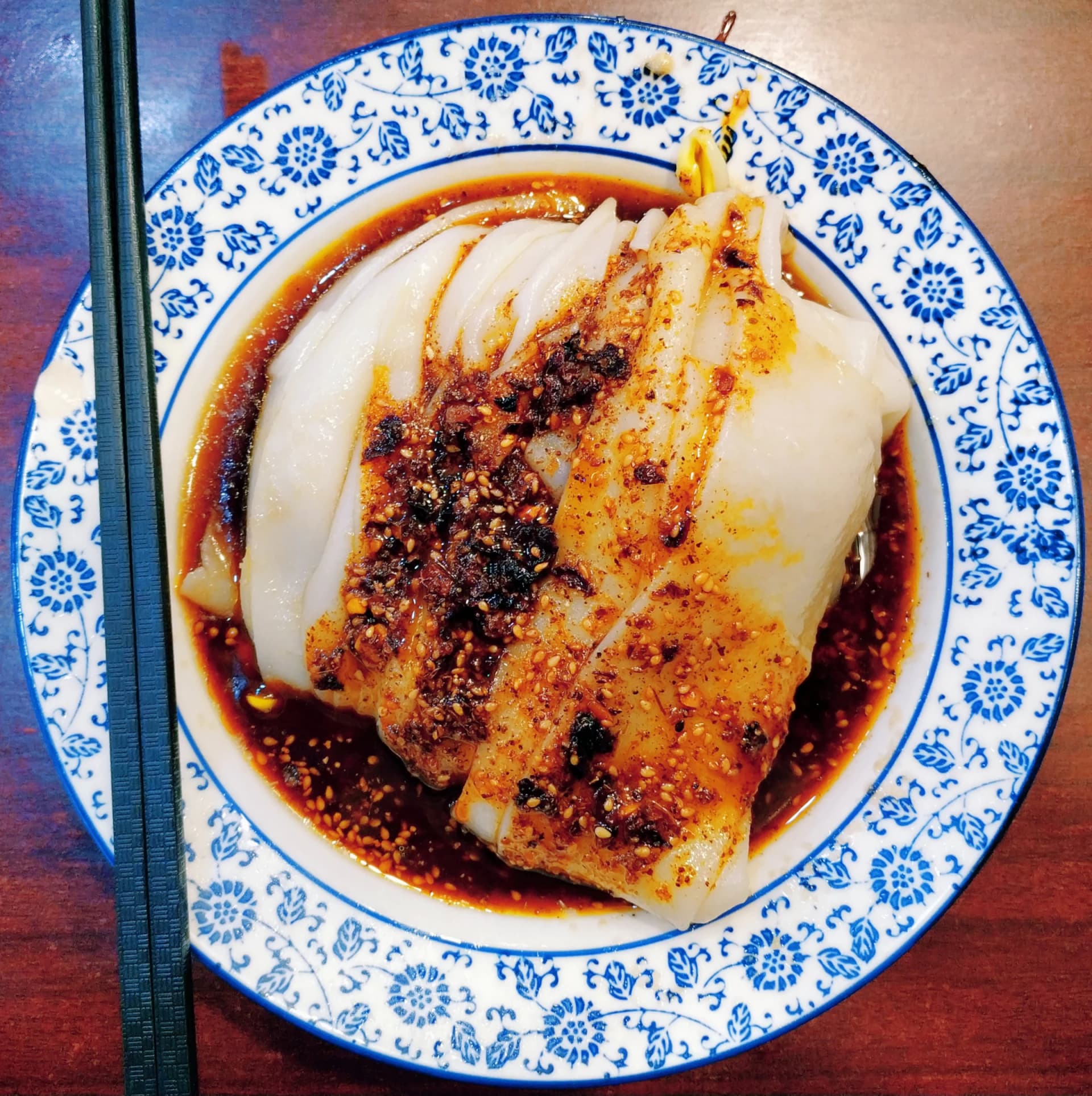 A bowl of Hanzhong mianpi with seasonings