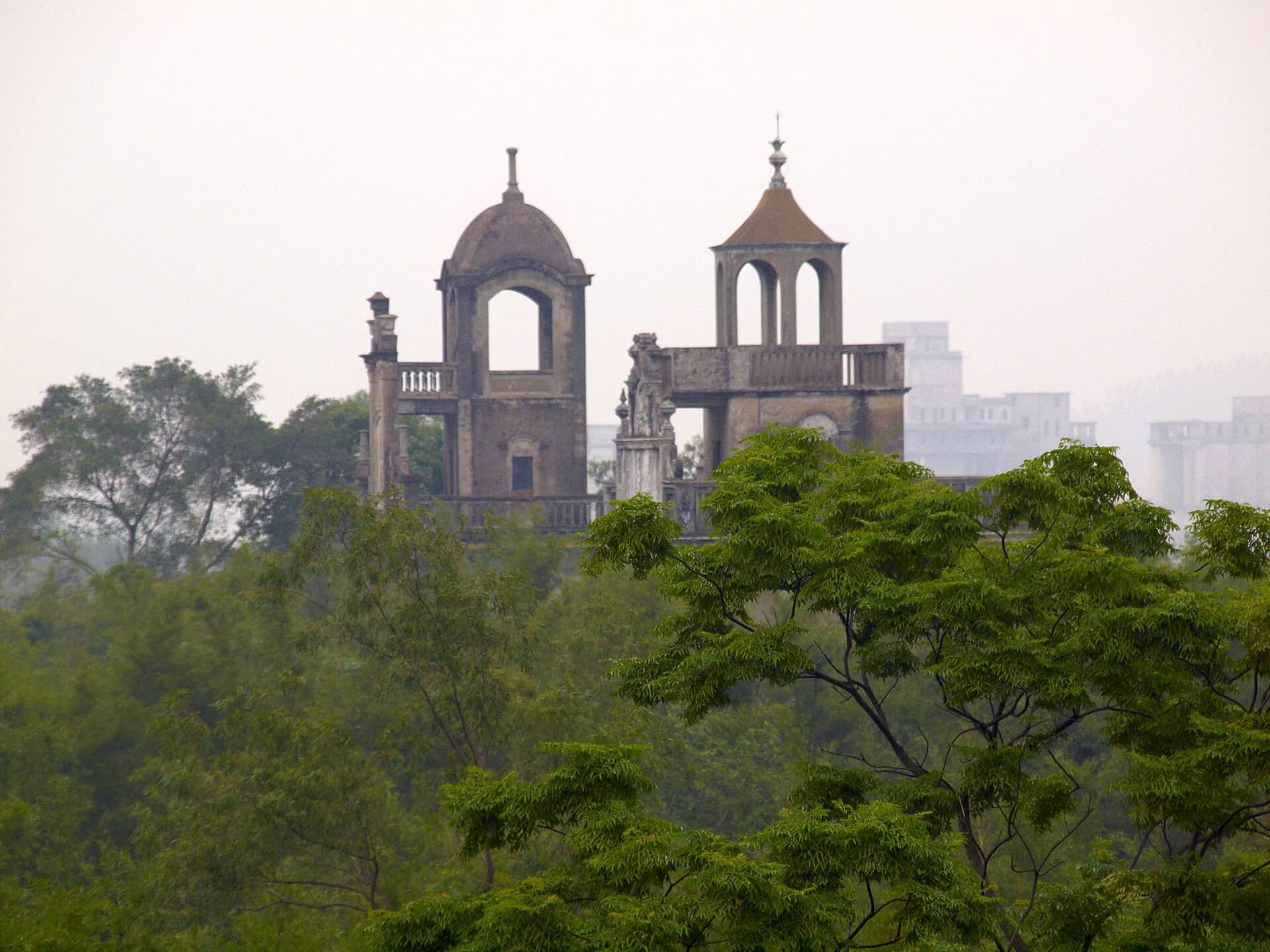 Diaolou tower among trees and village vegetation in Majianglong
