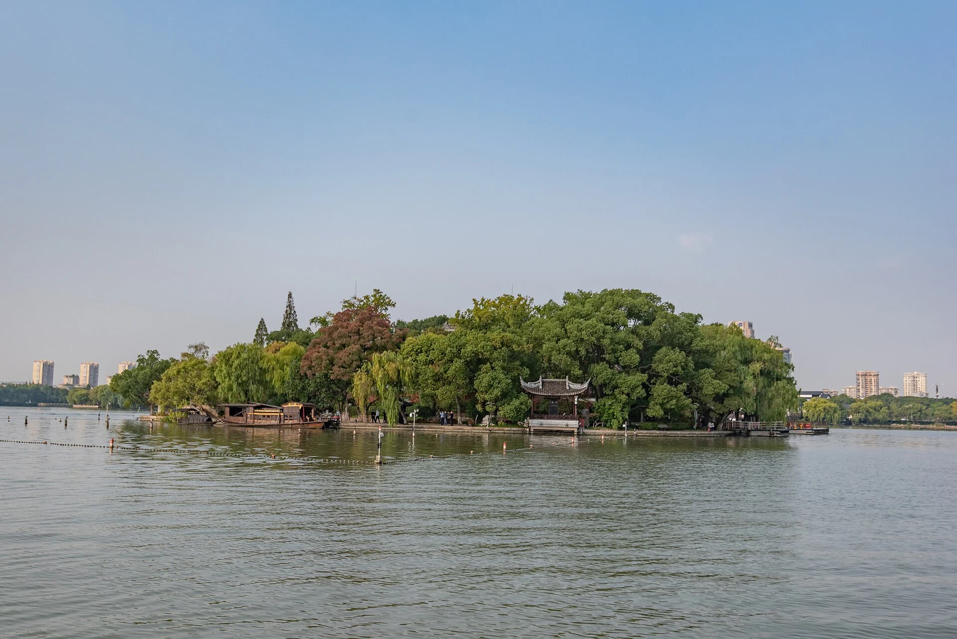 Bridge, trees and calm water at Jiaxing South Lake