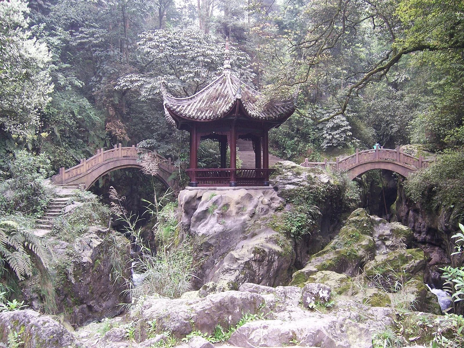 Qingyin pavilion and stone bridges within Mount Emei forest
