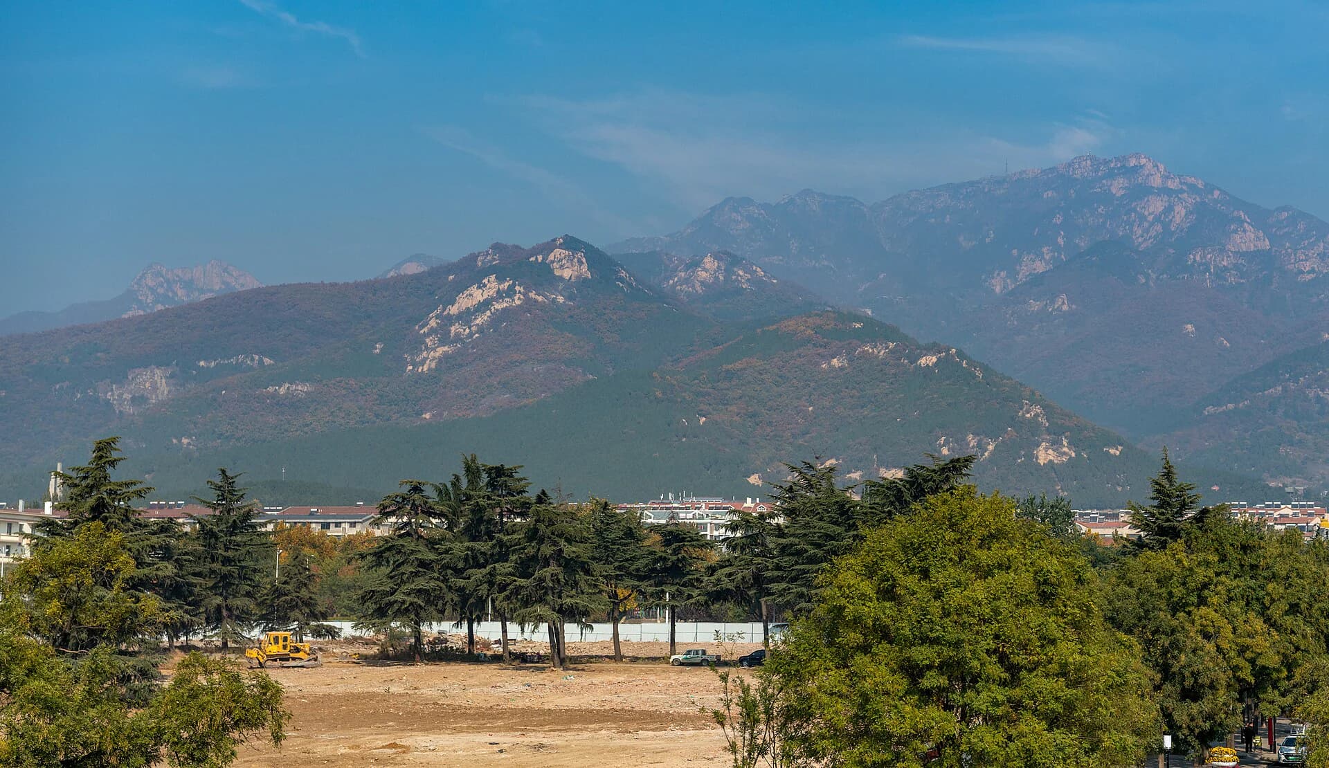 Mount Tai rising beyond the roofs of Dai Temple