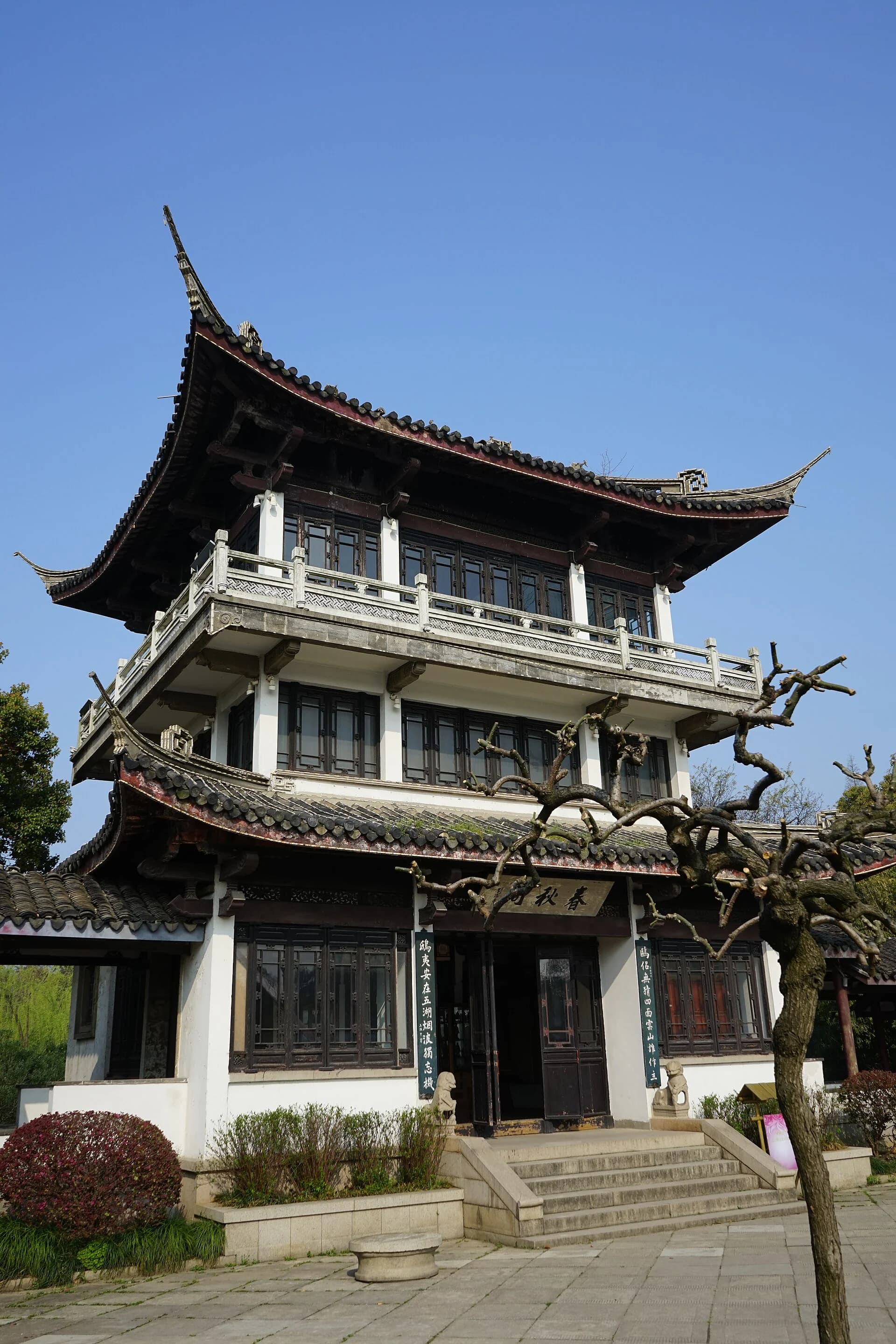 Spring and Autumn Pavilion reflected in a garden pond at Liyuan
