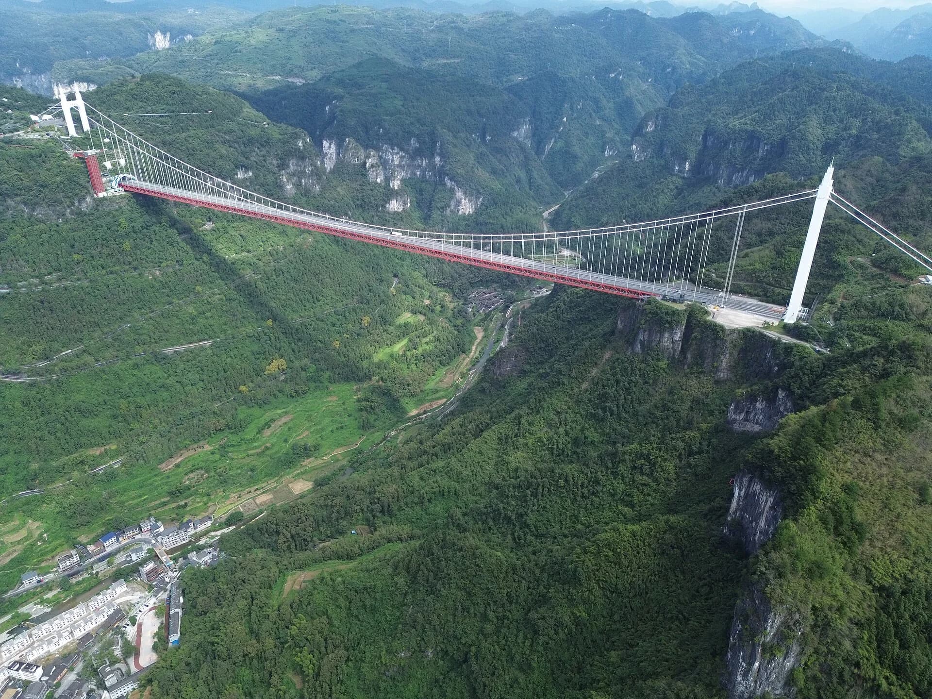 Aizhai Bridge crossing a green mountain gorge in Xiangxi