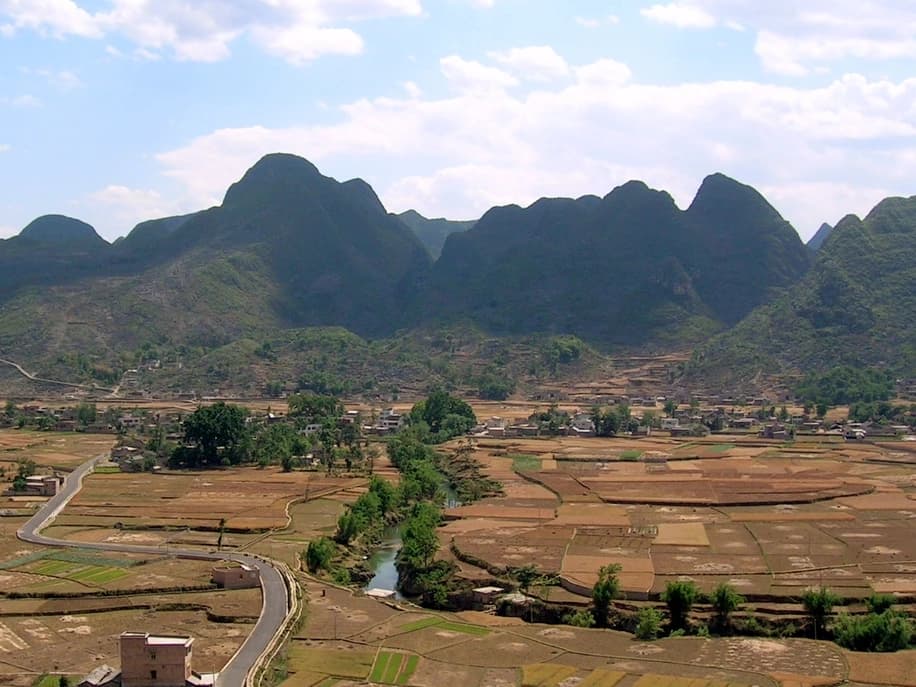 Village roads, river and fields below Wanfenglin's karst peaks