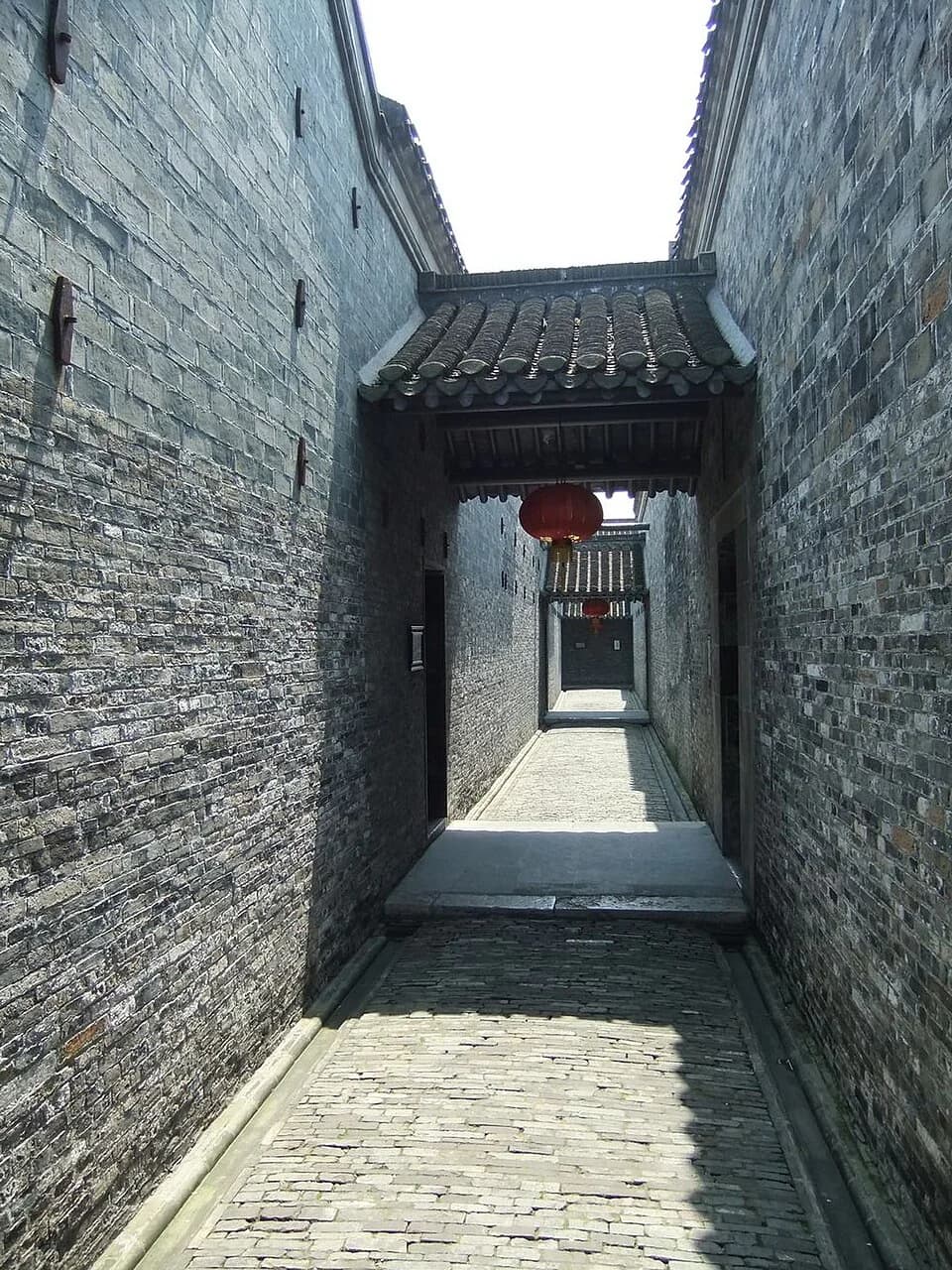 Empty covered corridor leading through Ge Garden