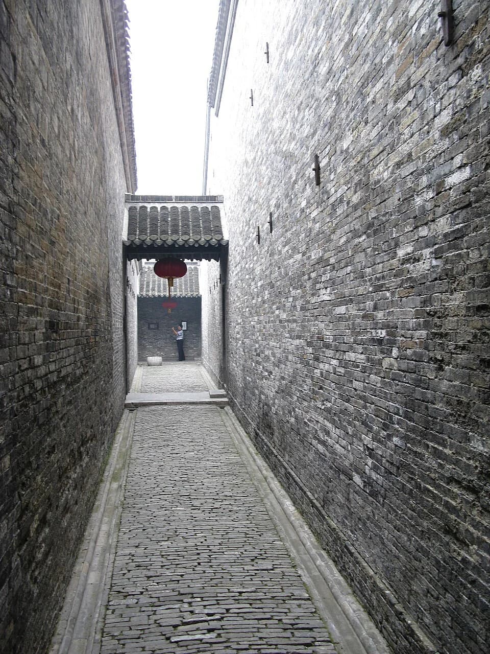 Grey-brick residential corridor in Ge Garden