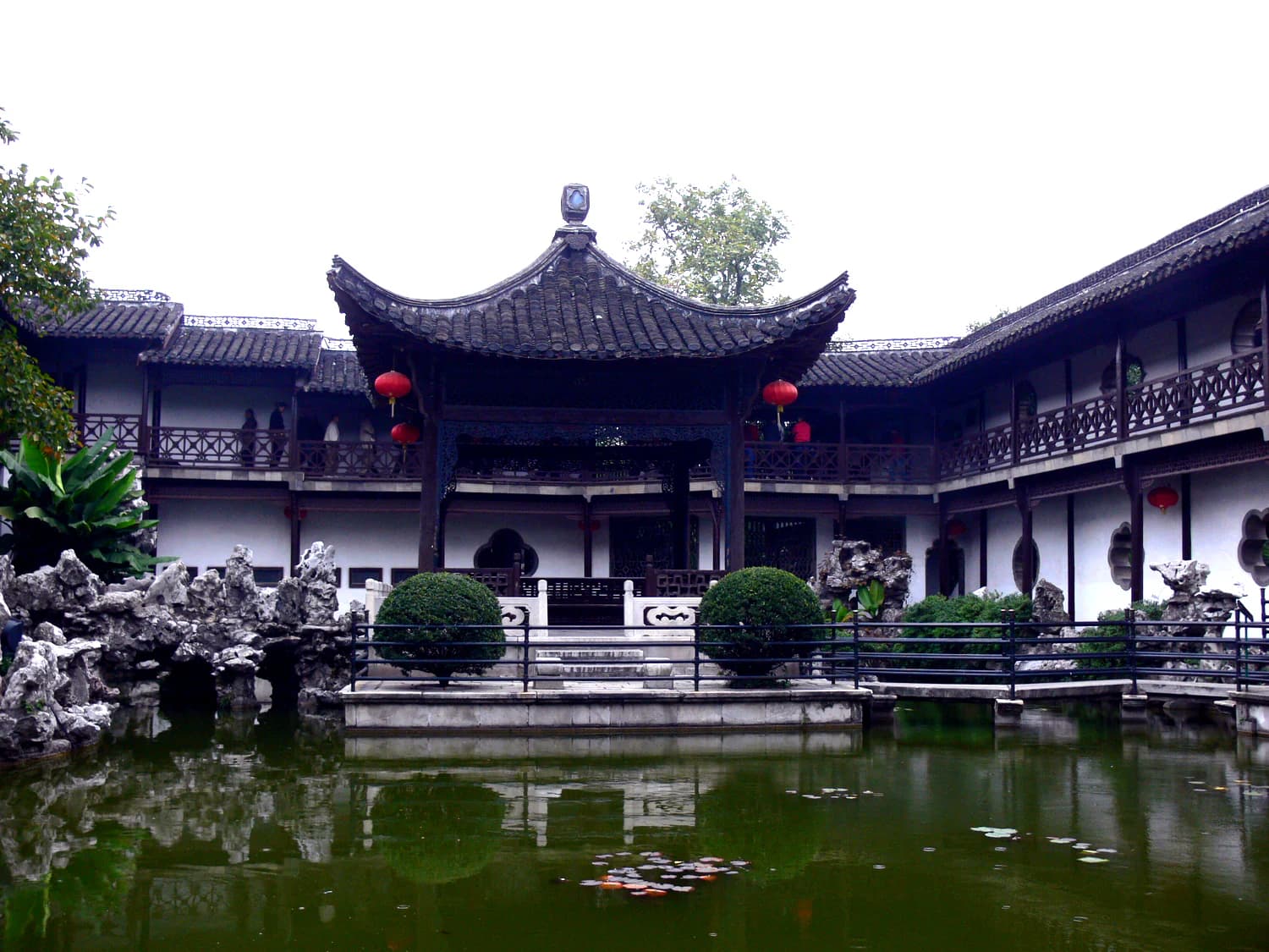 Pond and two-level covered corridor inside He Garden